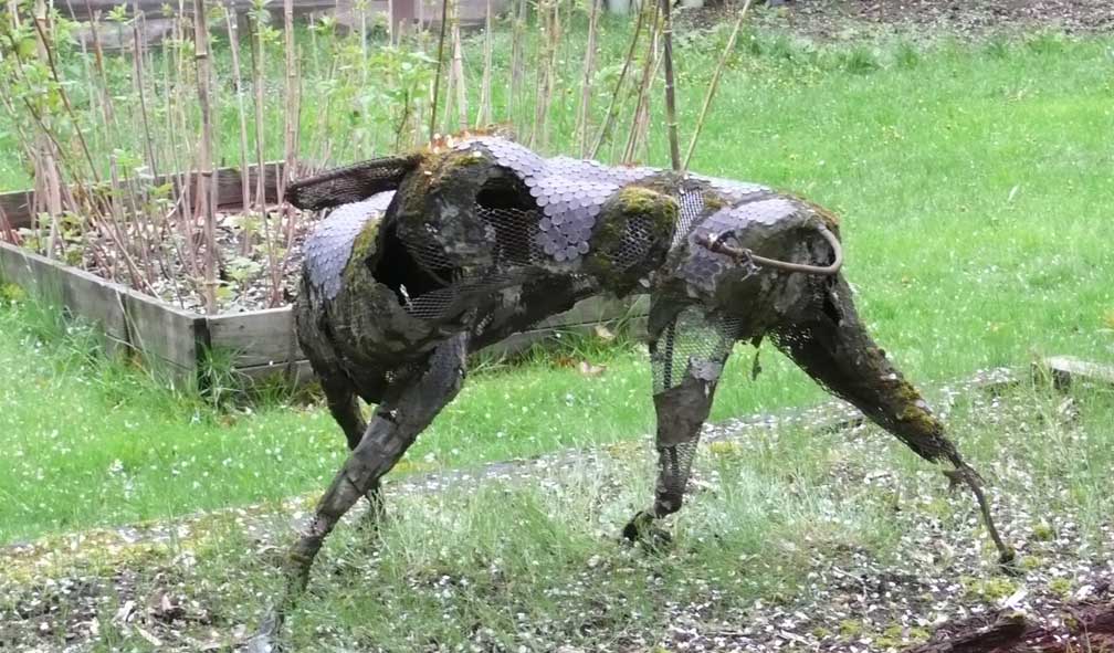 dog chasing tail sculpture
